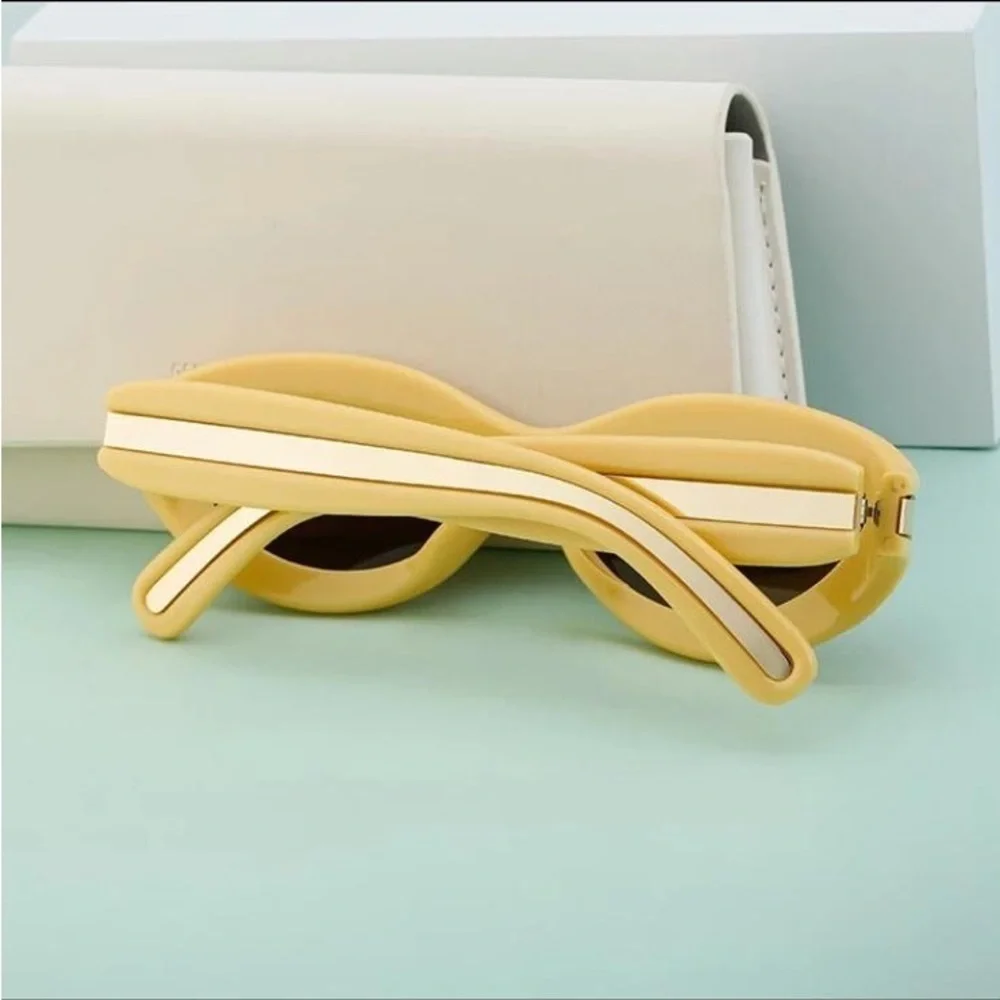 Luxury futuristic cat eye oval mustard pastel yellow steampunk sunglasses